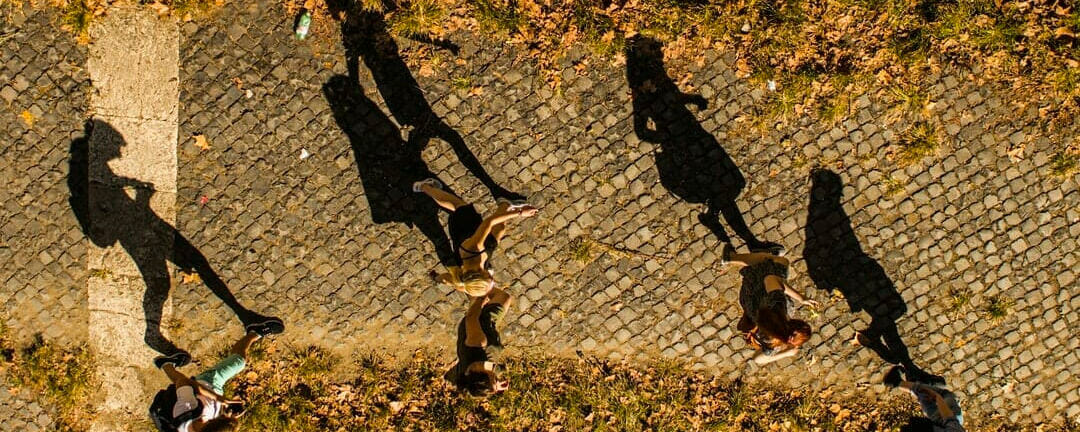 Students walking with long shadows