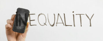 Equality written on a dry erase board
