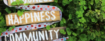 Health, Goodness, Happiness, Community sign